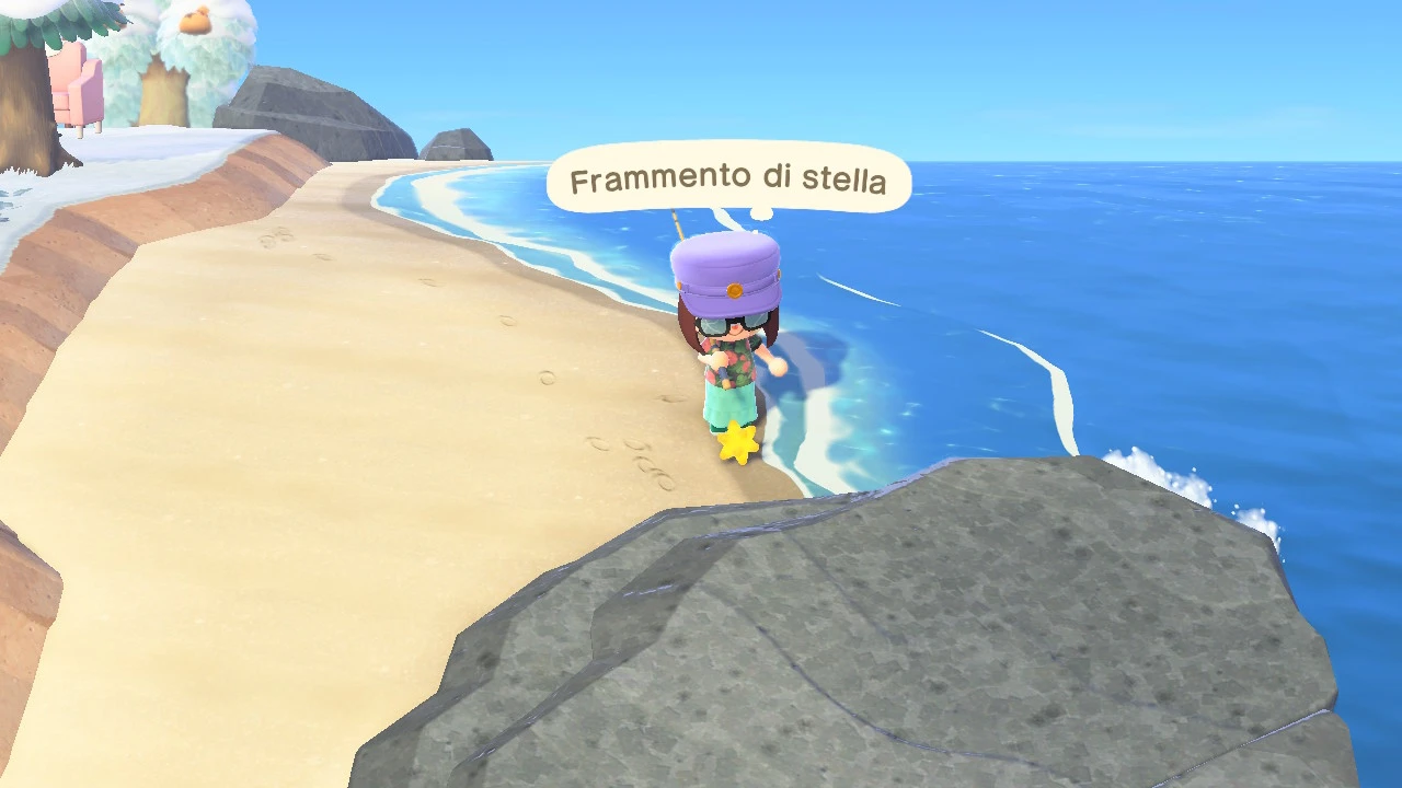 Io sopra ad un frammento di stella sulla spiaggia a destra dell'isola